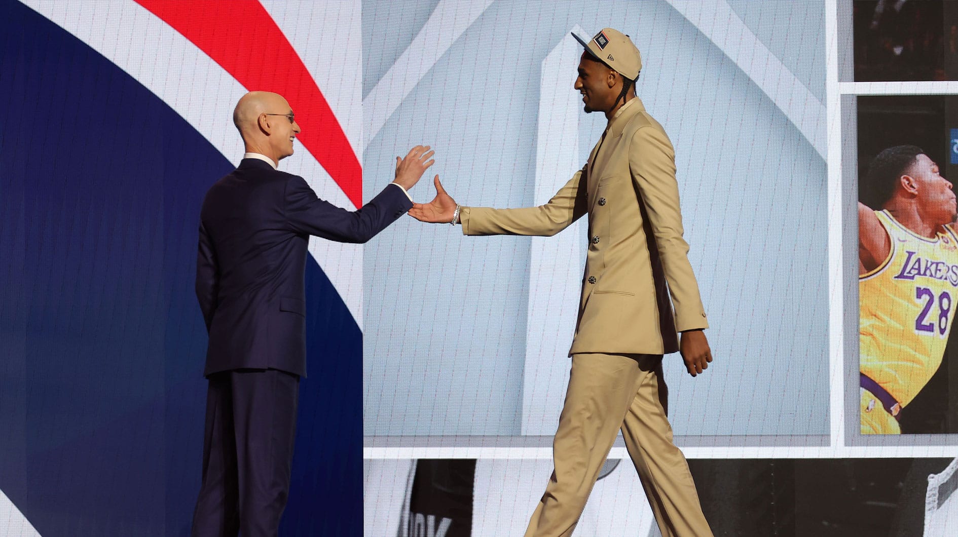 Alexander Sarr shakes hands with NBA commissioner Adam Silver after being selected in the first round by the Washington Wizards in the 2024 NBA Draft at Barclays Center.