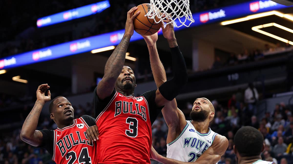 Chicago Bulls center Andre Drummond (3) catches a rebound as Minnesota Timberwolves center Rudy Gobert (27) defends during the first half at Target Center.