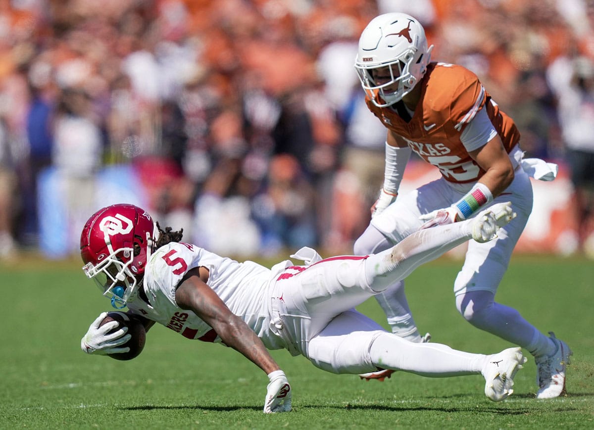Oklahoma Sooners wide receiver Andrel Anthony (5) fights for yardage during an NCAA college football game at the Cotton Bowl