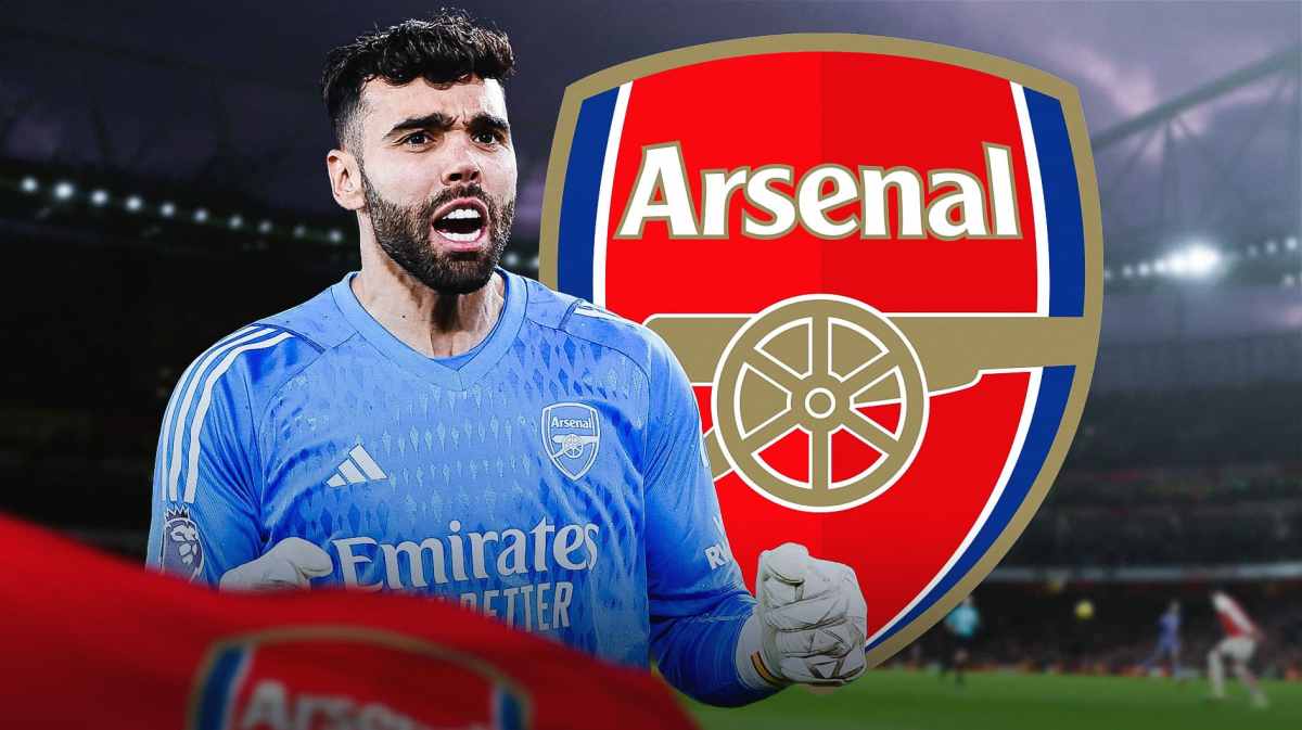 David Raya in front of the Arsenal logo