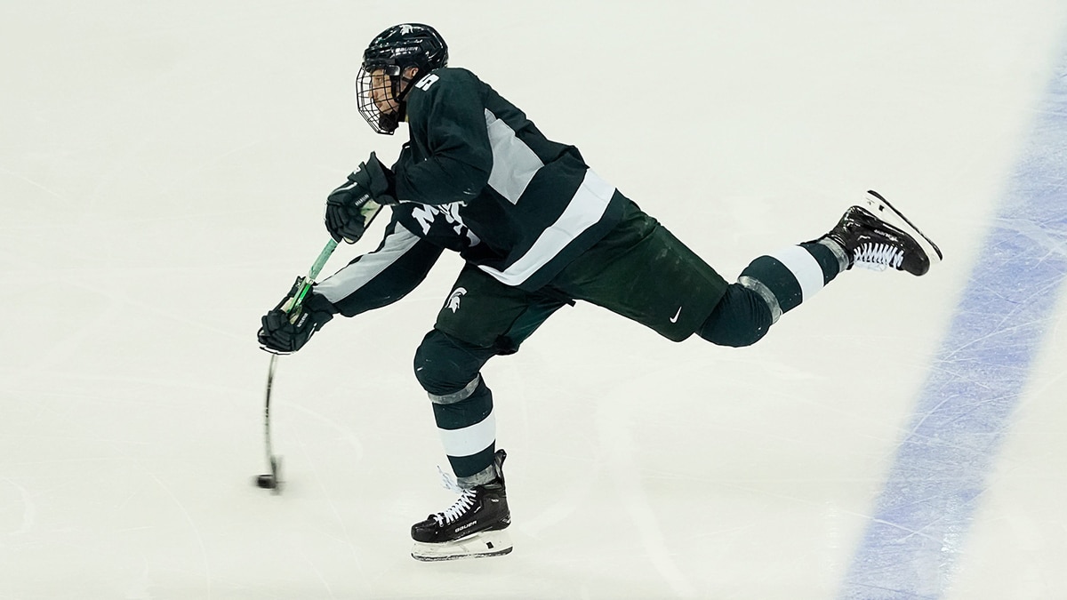 Michigan St. defenseman Artyom Levshunov (5) takes a slapshot during the second period of the match against Wisconsin on Saturday March 2, 2024 at the Kohl Center in Madison, Wis.