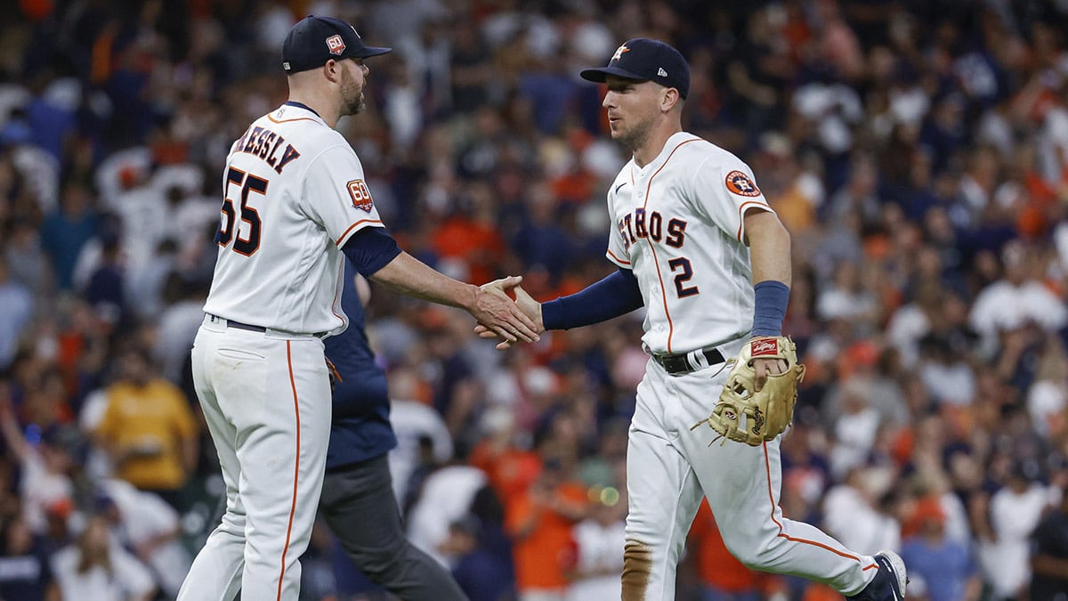  Houston Astros relief pitcher Ryan Pressly (55) and third baseman Alex Bregman (2) celebrate after the Astros defeated the New York Yankees 