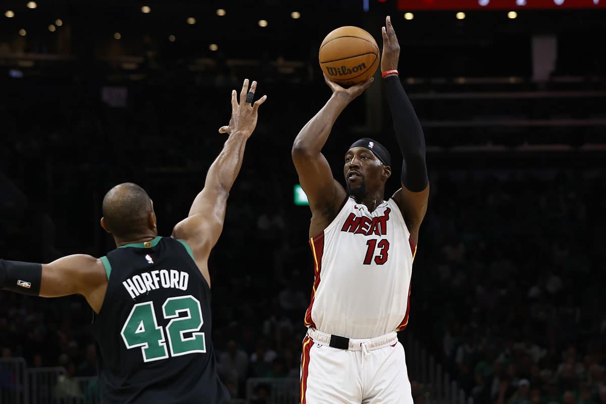Miami Heat center Bam Adebayo (13) shoots against Boston Celtics center Al Horford (42) during the first quarter of game five of the first round of the 2024 NBA playoffs at TD Garden.
