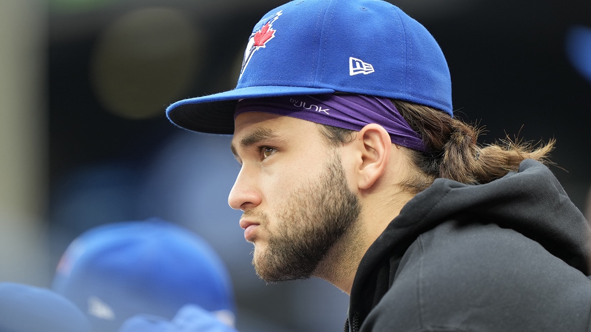 An inured Toronto Blue Jays shortstop Bo Bichette (11) sits in the durgout during the second inning against the Boston Red Sox at Rogers Centre.