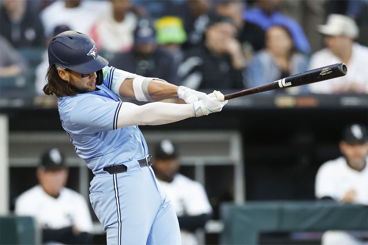 Toronto Blue Jays shortstop Bo Bichette (11) hits an RBI-single against the Chicago White Sox during the third inning at Guaranteed Rate Field.