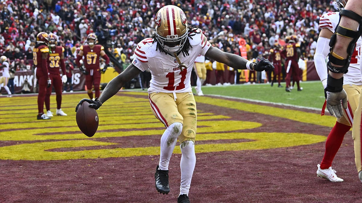 San Francisco 49ers wide receiver Brandon Aiyuk (11) celebrates after scoring a touchdown against the Washington Commanders during the second half at FedExField.