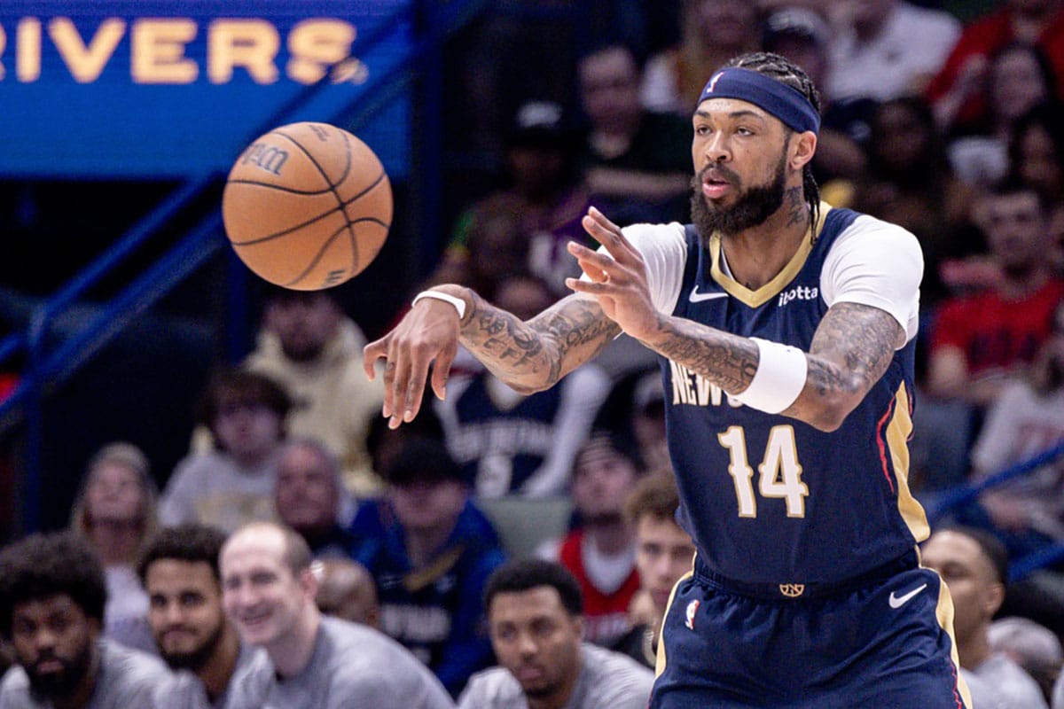  New Orleans Pelicans forward Brandon Ingram (14) passes the ball against the Cleveland Cavaliers during the first half at Smoothie King Center.