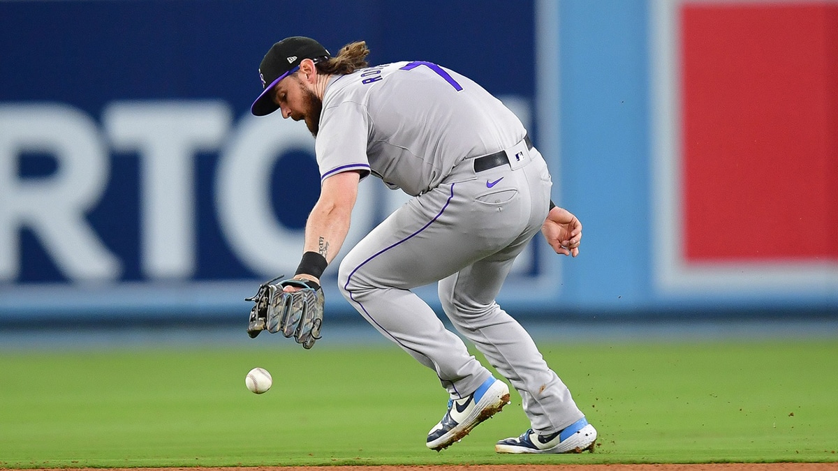 Colorado Rockies second baseman Brendan Rodgers (7) is unable to field the single of Los Angeles Dodgers second baseman Gavin Lux (9) during the fifth inning at Dodger Stadium.