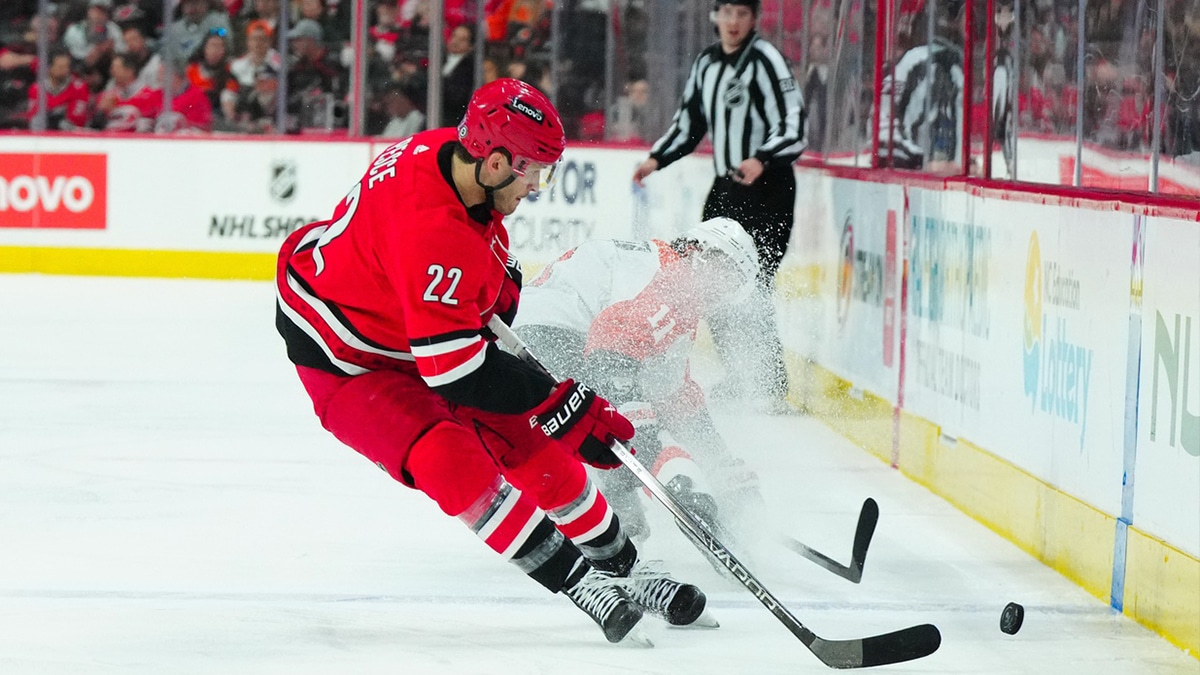 Carolina Hurricanes defenseman Brett Pesce (22) gets to the puck ahead of Philadelphia Flyers right wing Travis Konecny (11) during the second period at PNC Arena.
