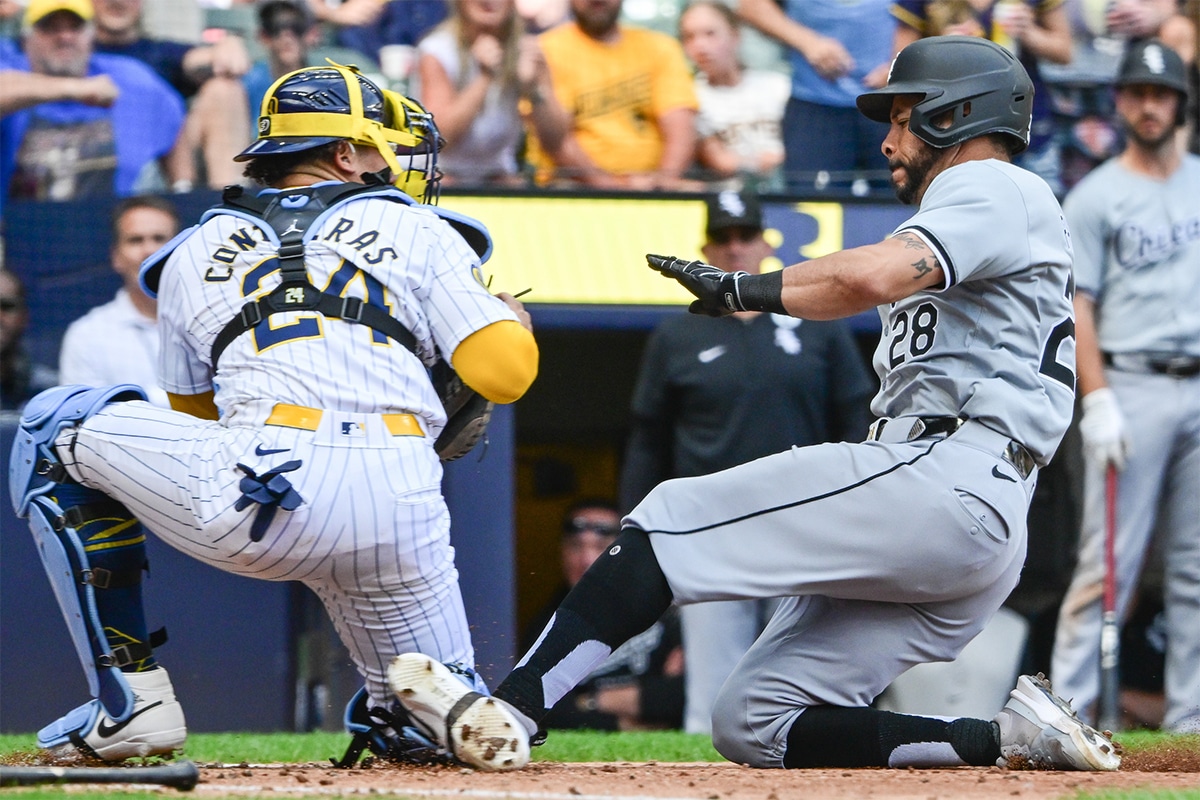Milwaukee Brewers catcher William Contreras (24) tags out Chicago White Sox left fielder Tommy Pham (28) trying to score in the eighth inning at American Family Field. 