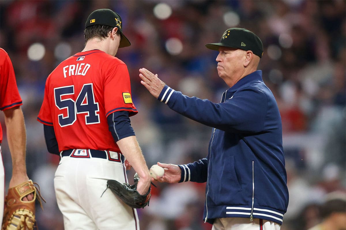  Atlanta Braves manager Brian Snitker (43) removes starting pitcher Max Fried (54) from a game against the San Diego Padres in the fifth inning at Truist Park