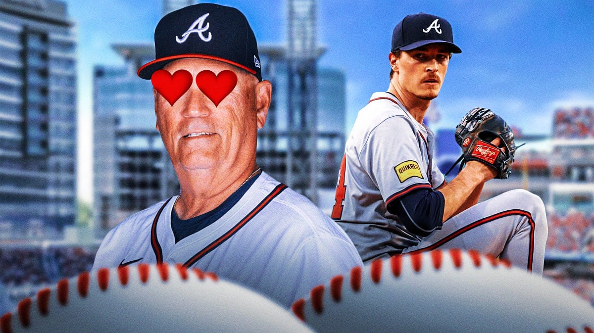 Brian Snitker with heart eyes looking at Max Fried. Fenway Park in the background.