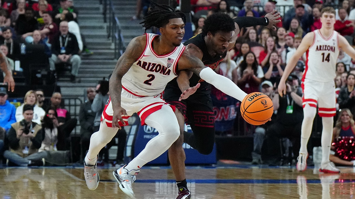 Arizona Wildcats guard Caleb Love (2) and Southern California Trojans guard Bronny James (6) battle for the ball in the first half at T-Mobile Arena. 