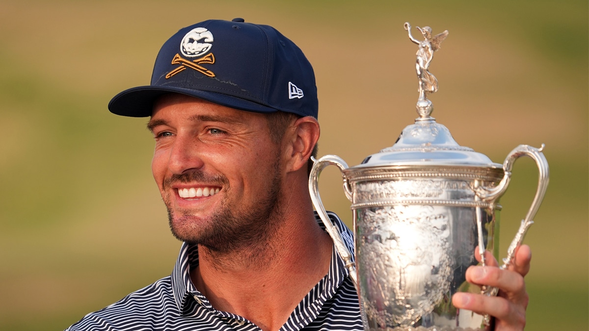Bryson DeChambeau celebrates with the trophy after winning the U.S. Open golf tournament.