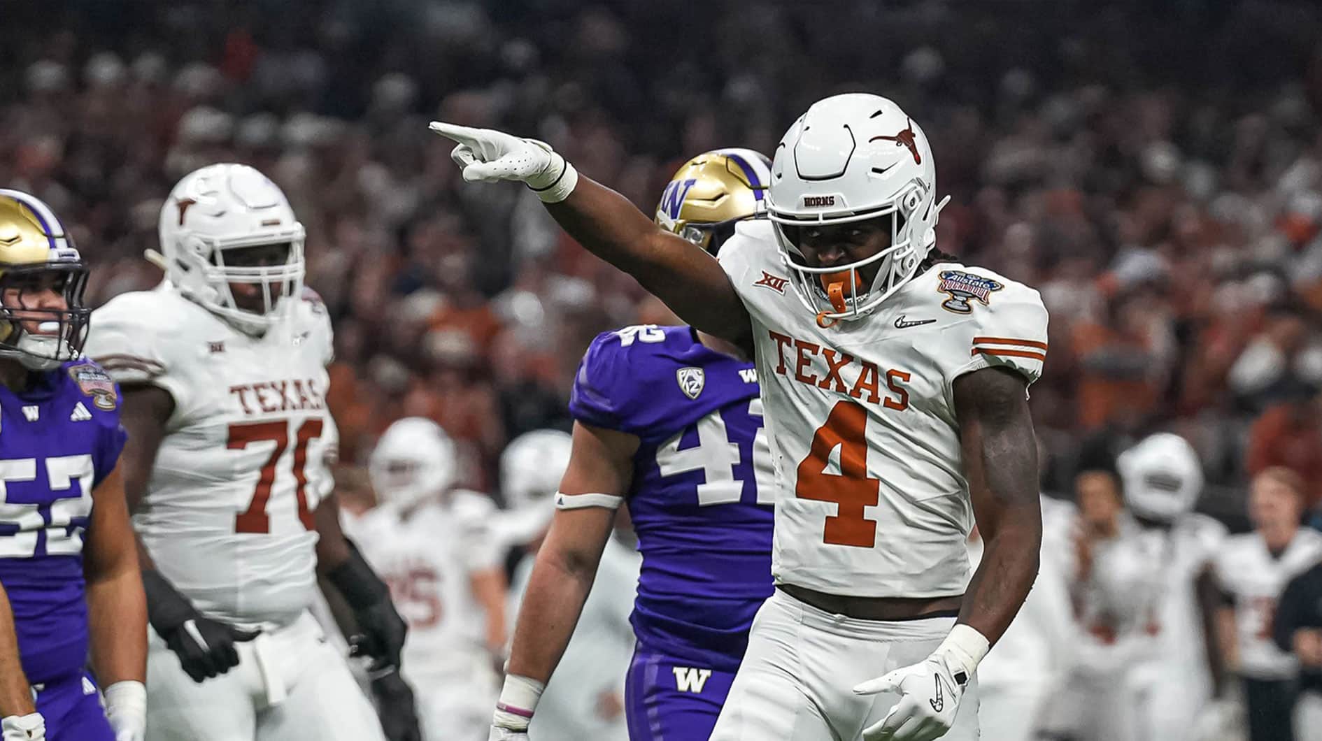 Texas Longhorns running back CJ Baxter (4) celebrates a first down during the Sugar Bowl College Football Playoff semifinals game against the Washington Huskies at the Caesars Superdome