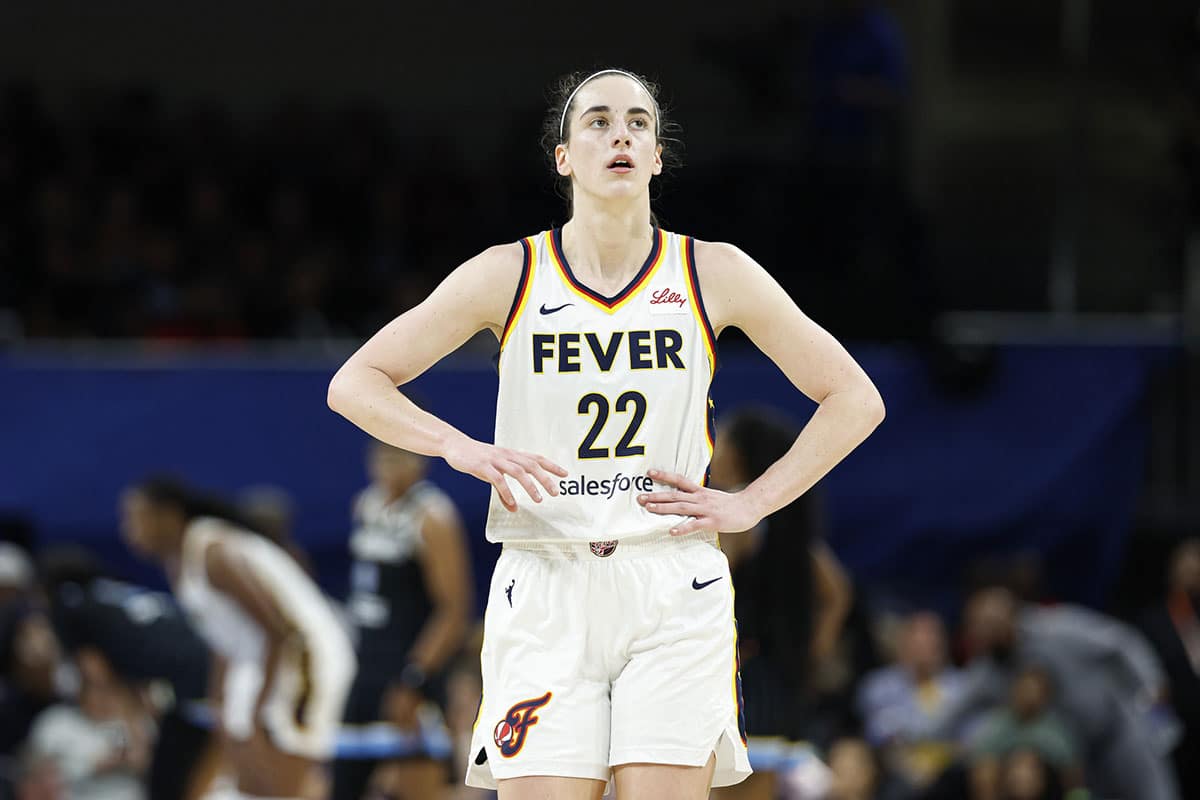 Indiana Fever guard Caitlin Clark (22) walks on the court during the second half of a basketball game against the Chicago Sky at Wintrust Arena.