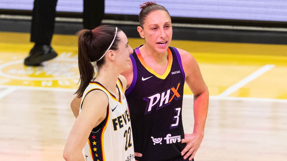 Indiana Fever guard Caitlin Clark (22) and Phoenix Mercury guard Diana Taurasi (3) talk at half court during a free throw on June 30, 2024, at Footprint Center in Phoenix.