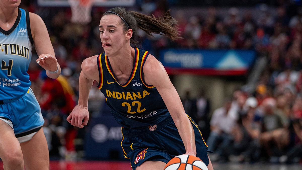 Indiana Fever guard Caitlin Clark (22) dribbles around Chicago Sky guard Marina Mabrey (4) on Sunday June 16, 2024, during the game at Gainbridge Fieldhouse in Indianapolis
