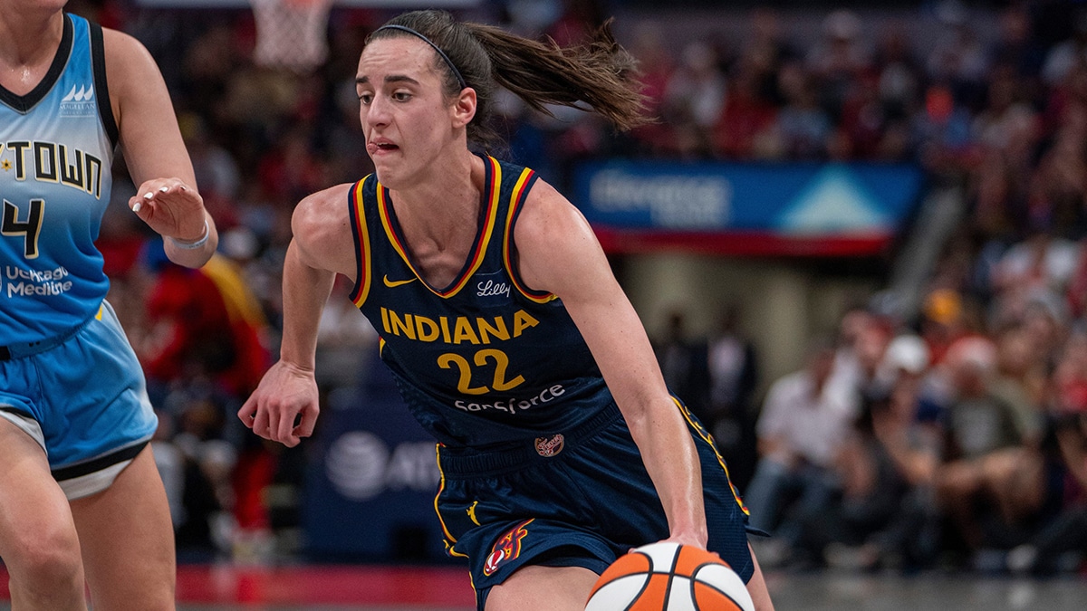 Indiana Fever guard Caitlin Clark (22) dribbles around Chicago Sky guard Marina Mabrey (4) on Sunday June 16, 2024, during the game at Gainbridge Fieldhouse in Indianapolis. The Fever beat the Sky 91-83.