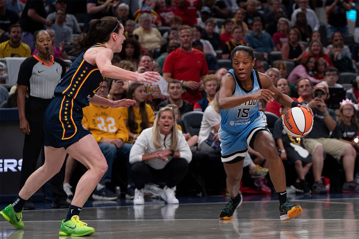 Chicago Sky guard Lindsay Allen (15) attempts to dribble around Indiana Fever guard Caitlin Clark (22) on Sunday June 16, 2024, during the game. The Fever beat the Sky 91-83.