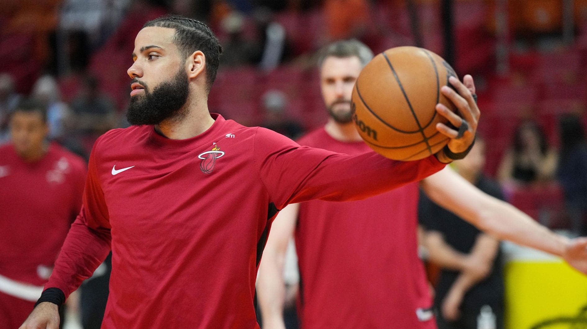 Miami Heat forward Caleb Martin (16) warms up before the game against the Toronto Raptors at Kaseya Center.