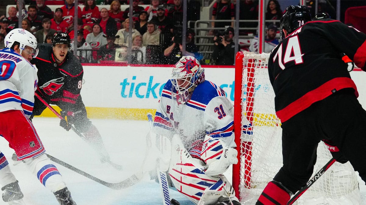 New York Rangers goaltender Igor Shesterkin (31) stops the shot by Carolina Hurricanes defenseman Jaccob Slavin (74) during the third period in game six of the second round of the 2024 Stanley Cup Playoffs at PNC Arena.