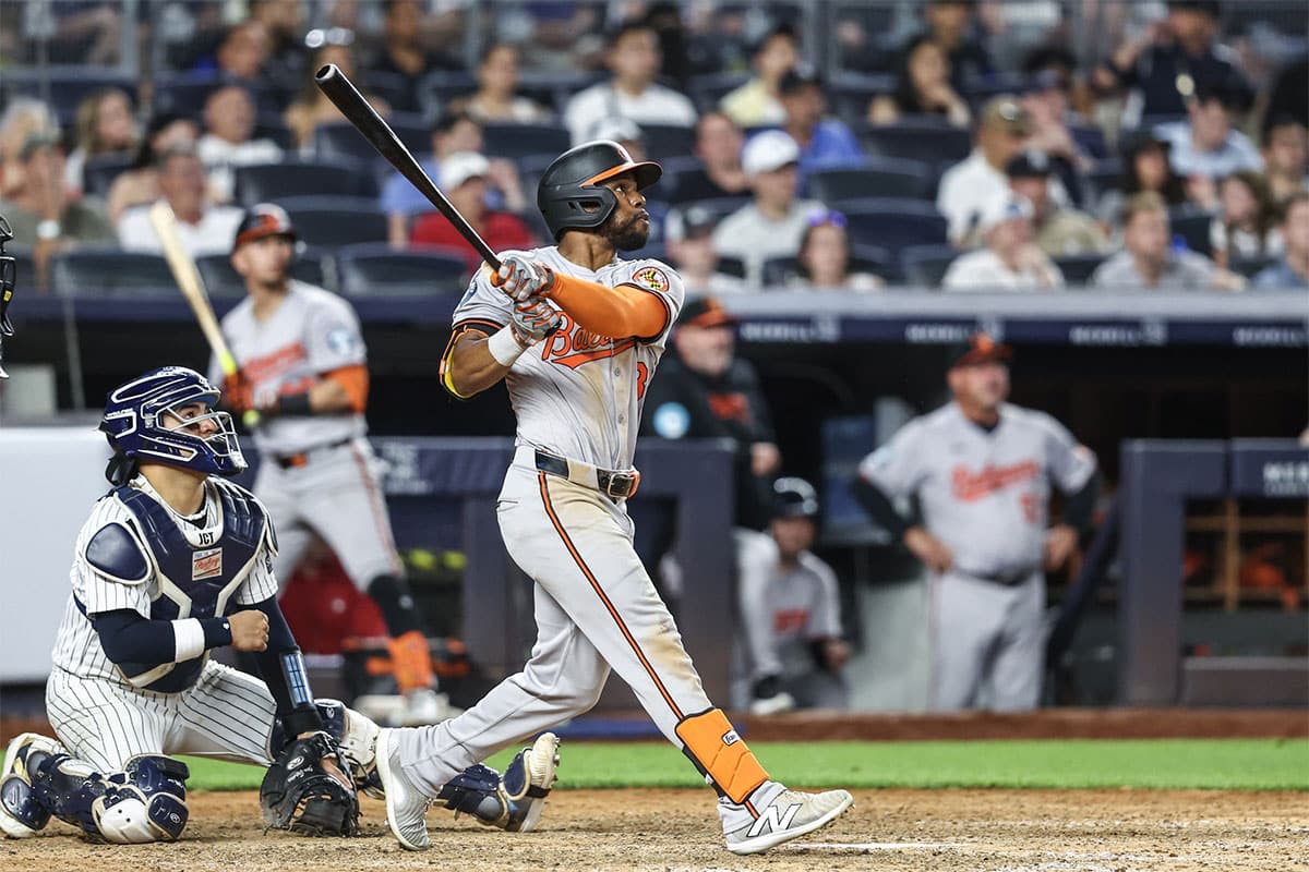 Baltimore Orioles center fielder Cedric Mullins (31) hits an RBI single in the tenth inning against the New York Yankees at Yankee Stadium.