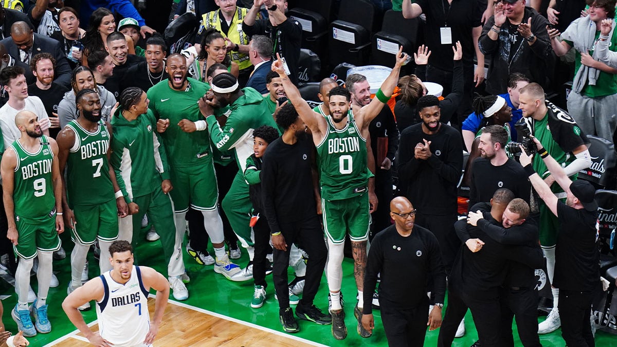 Boston Celtics forward Jayson Tatum (0) celebrates with teammates after defeating the Dallas Mavericks in game five to win the 2024 NBA Finals at TD Garden.