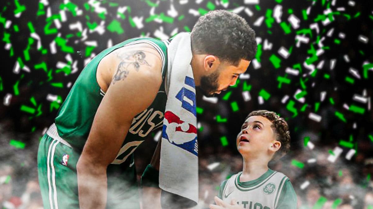 Jayson Tatum with Deuce Tatum. Green and white confetti falling