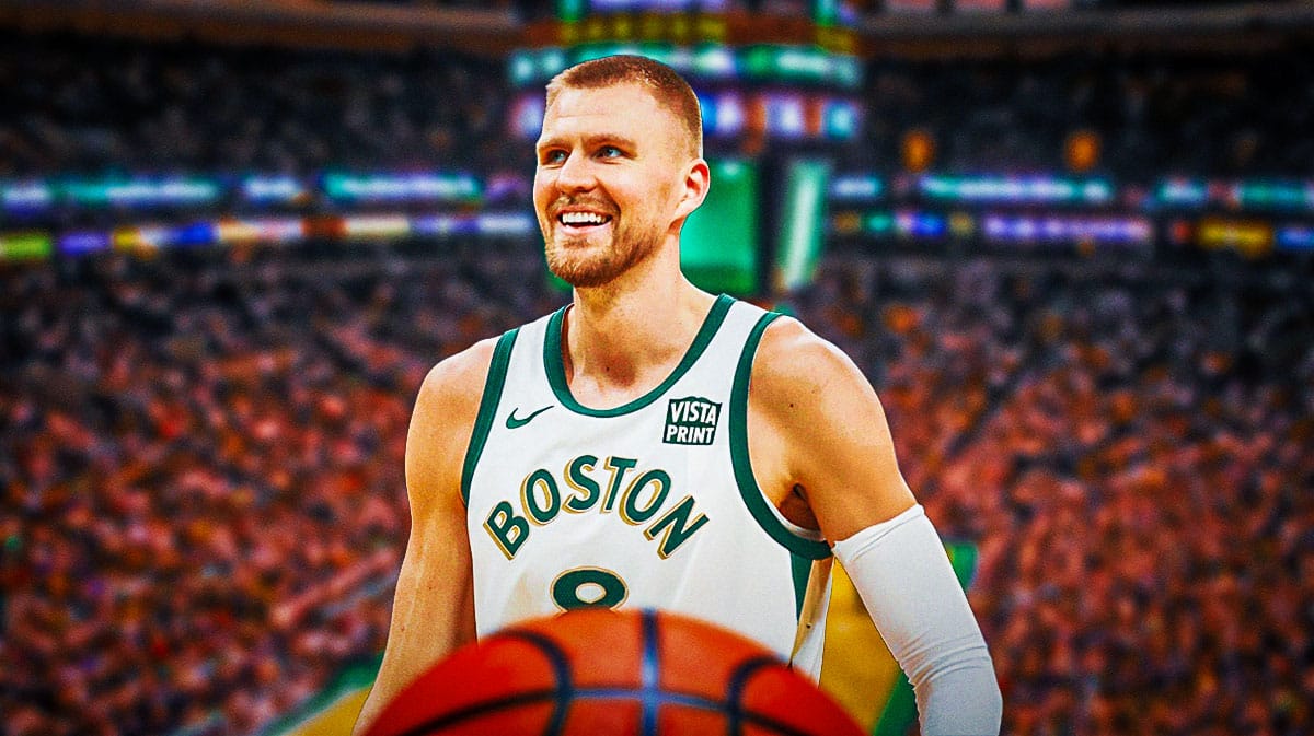 Kristaps Porzingis smiling on a TD Garden background
