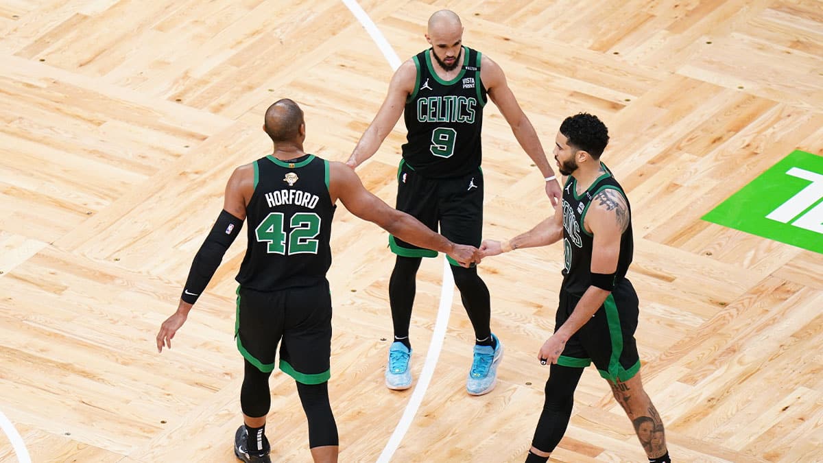 Boston Celtics center Al Horford (42) and guard Derrick White (9) and forward Jayson Tatum (0) celebrate after defeating the Dallas Mavericks in game two of the 2024 NBA Finals at TD Garden