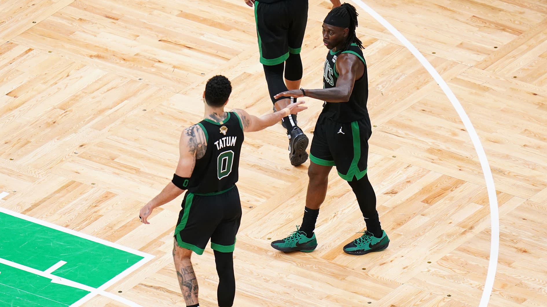 Boston Celtics forward Jayson Tatum (0) and guard Jrue Holiday (4) celebrate after game two against the Dallas Mavericks in the 2024 NBA Finals at TD Garden