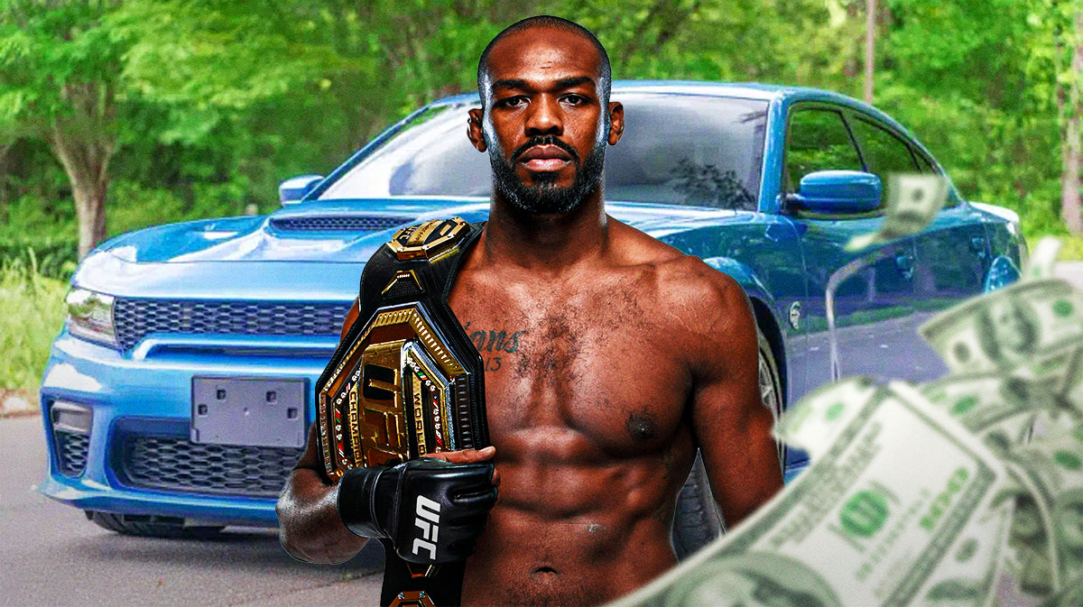 Jon Jones in front of a car from his collection.