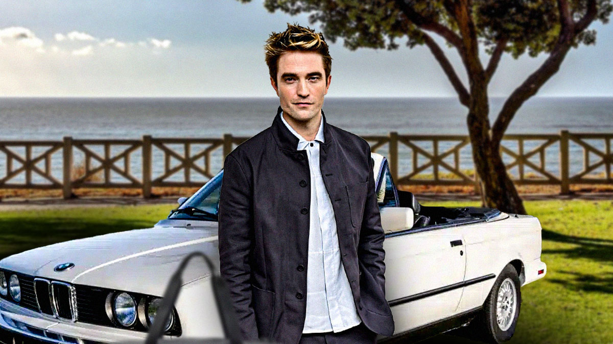 Robert Pattinson in front of a car from his collection.