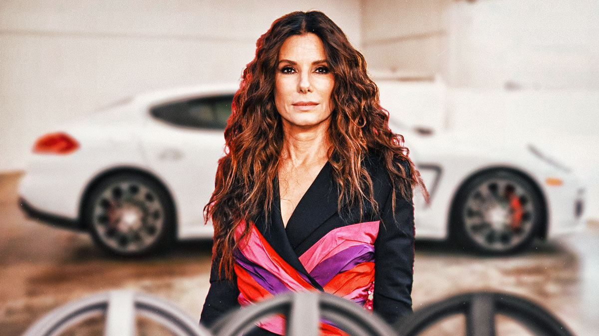 Sandra Bullock in front of a car from her collection.