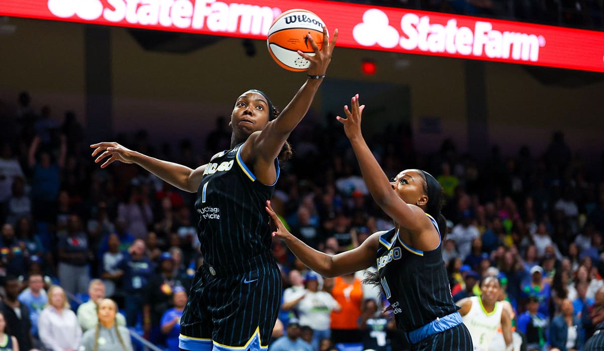 Chicago Sky center Elizabeth Williams (1) grabs the ball in front of Chicago Sky guard Dana Evans (11) during the first quarter against the Dallas Wings.
