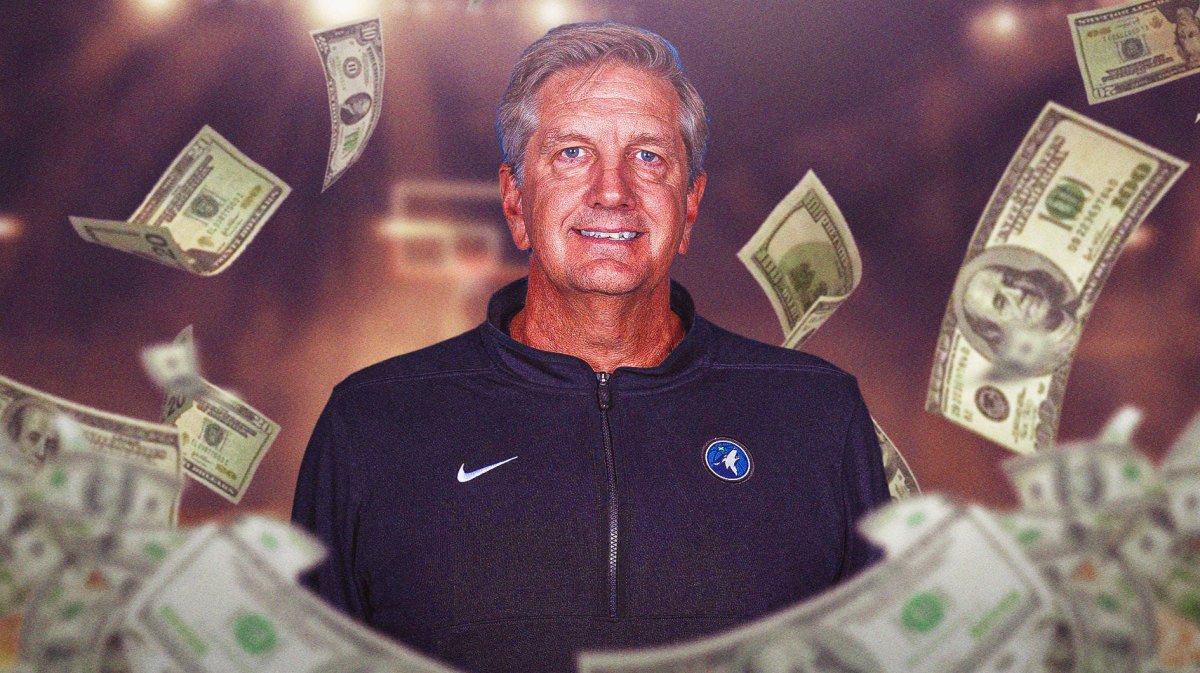 Chris Finch surrounded by piles of cash.