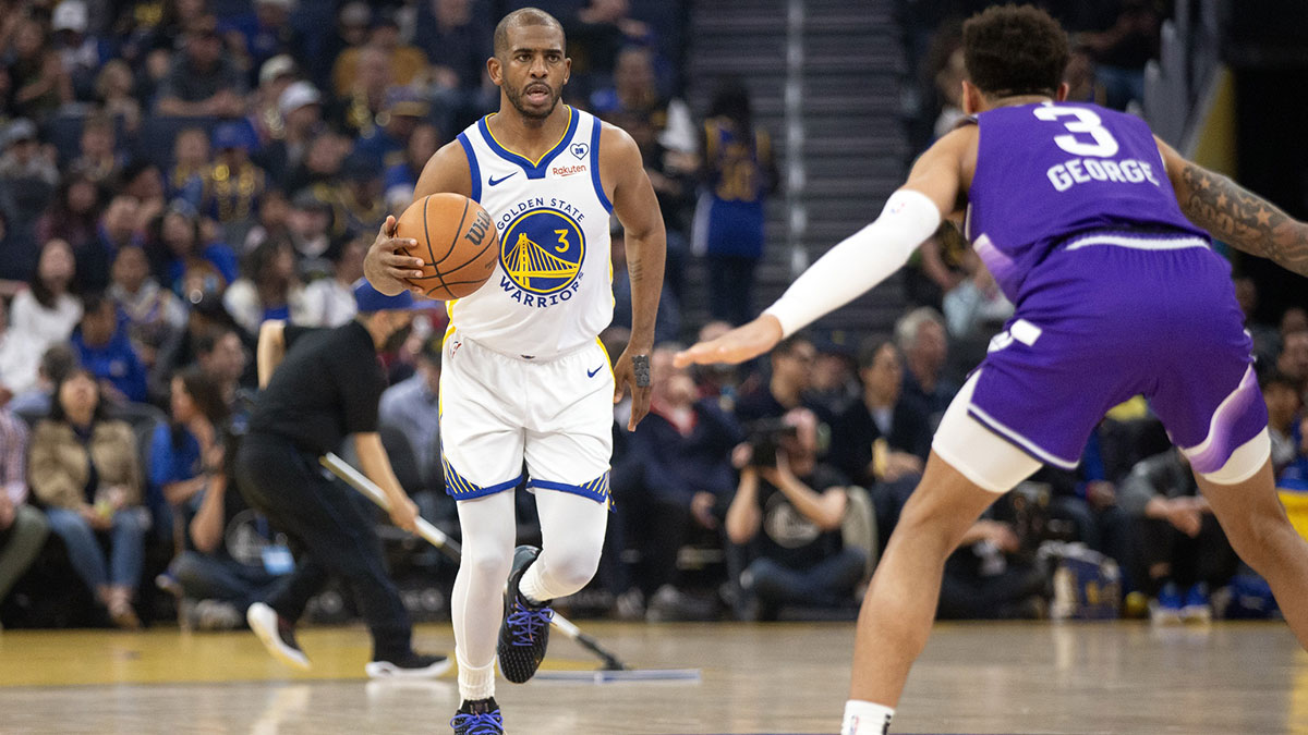 Golden State Warriors guard Chris Paul (3) brings the ball up court against the Utah Jazz during the first quarter at Chase Center