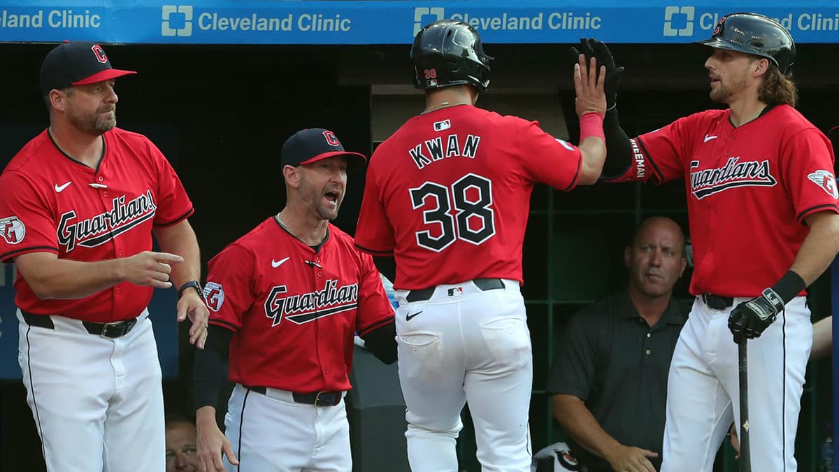 Cleveland Guardians left fielder Steven Kwan (38) is welcomed back to the dugout after scoring on a hit by José Ramírez during the first inning of an MLB game against the Seattle Mariners at Progressive Field, Wednesday, June 19, 2024, in Cleveland, Ohio.
