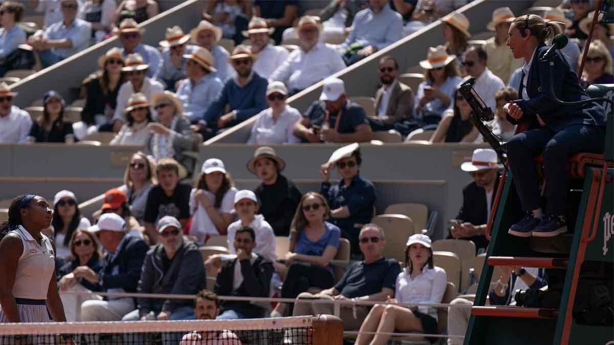 Coco Gauff of the United States discusses a call with chair umpire, Aurelie Tourte during her match against Iga Swiatek of Poland on day 12 of Roland Garros at Stade Roland Garros.
