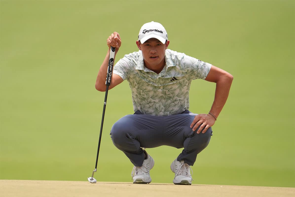 Collin Morikawa prepares to putt on the first green during the final round of the U.S. Open golf tournament.