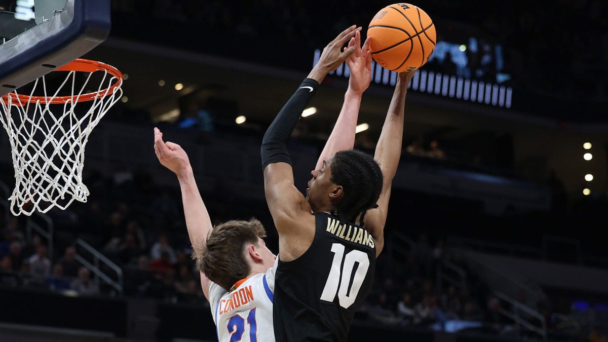 Colorado Buffaloes forward Cody Williams (10) shoots against Florida Gators forward Alex Condon (21) in the second half in the first round of the 2024 NCAA Tournament at Gainbridge FieldHouse