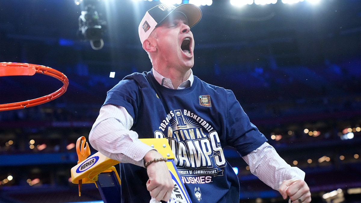 Apr 8, 2024; Glendale, Ariz, U.S.; Connecticut Huskies head coach Dan Hurley cuts down the cut after defeating the Purdue Boilermakers in the national championship game of the Final Four of the 2024 NCAA Tournament at State Farm Stadium in Glendale on April 8, 2024.