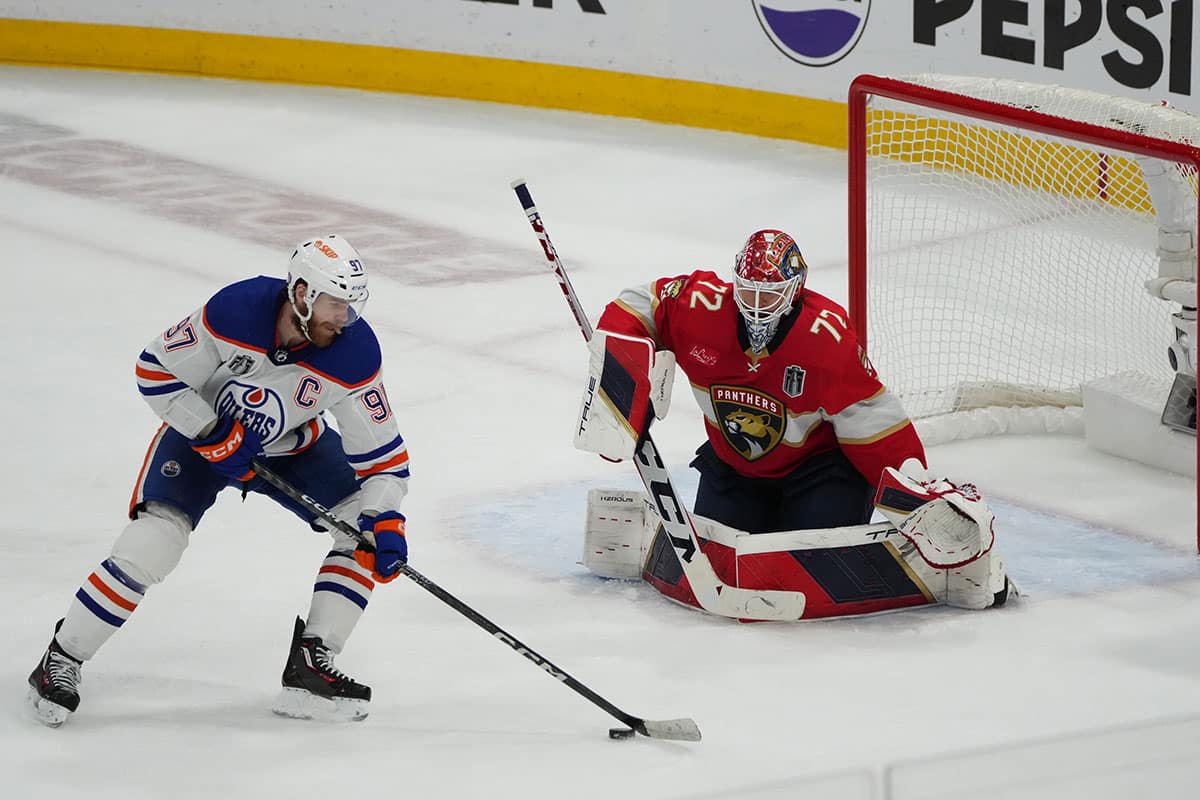 Florida Panthers goaltender Sergei Bobrovsky (72) defends against Edmonton Oilers forward Connor McDavid (97) during the third period in game seven of the 2024 Stanley Cup Final at Amerant Bank Arena.