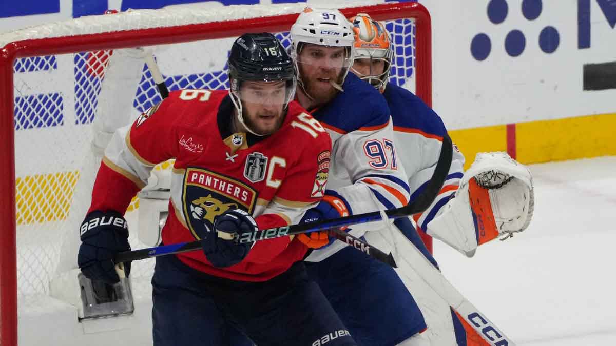 Florida Panthers forward Aleksander Barkov (16) defends against Edmonton Oilers forward Connor McDavid (97) during the first period in game seven of the 2024 Stanley Cup Final at Amerant Bank Arena.