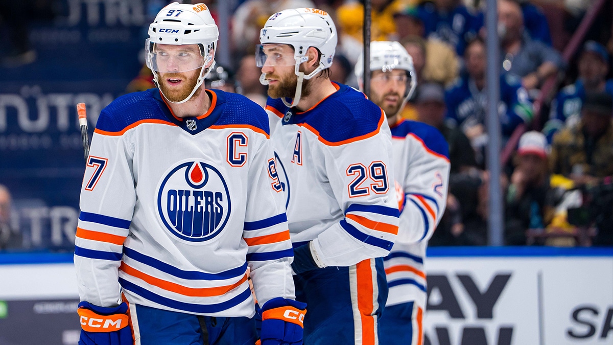 Edmonton Oilers forward Connor McDavid (97) and forward Leon Draisaitl (29) and defenseman Evan Bouchard (2) during a stop in play against the Vancouver Canucks during the first period in game five of the second round of the 2024 Stanley Cup Playoffs at Rogers Arena. 
