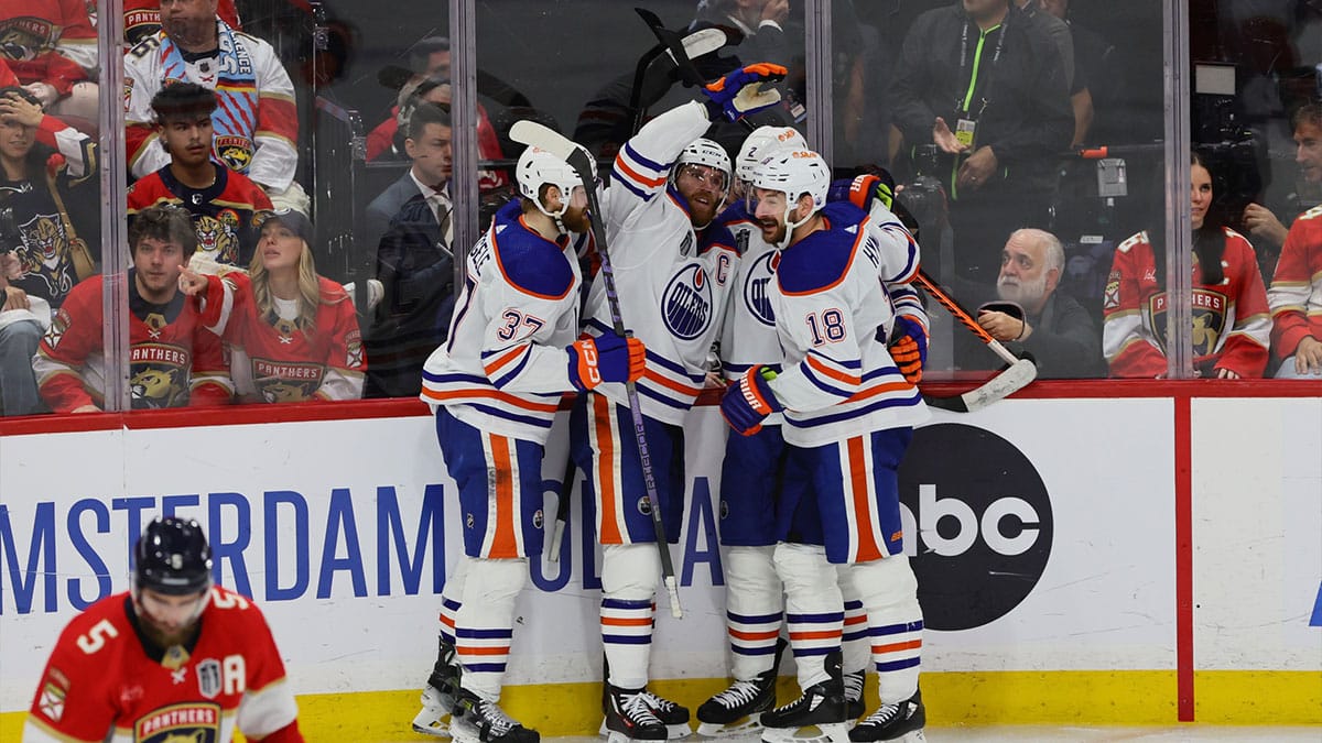 Edmonton Oilers forward Connor McDavid (97) celebrates scoring against the Florida Panthers with forward Warren Foegele (37) and defenseman Evan Bouchard (2) and forward Zach Hyman (18) during the second period in game five of the 2024 Stanley Cup Final at Amerant Bank Arena.