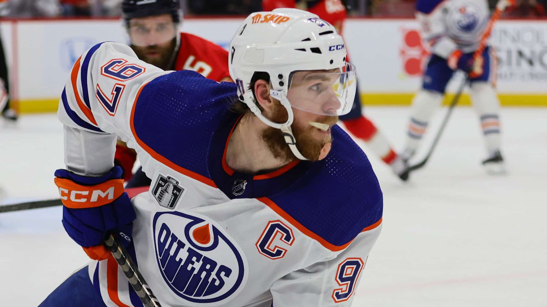 Edmonton Oilers forward Connor McDavid (97) plays the puck against the Florida Panthers during the third period in game one of the 2024 Stanley Cup Final at Amerant Bank Arena.