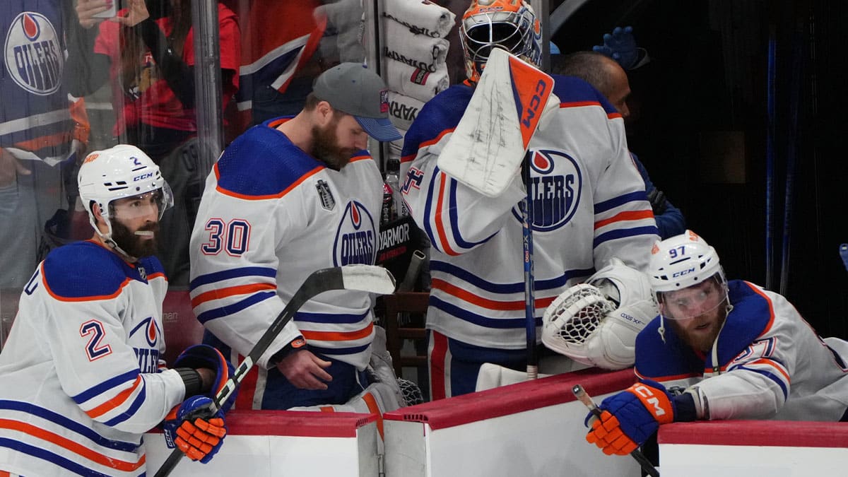 Edmonton Oilers forward Connor McDavid (97) and goaltender Calvin Pickard (30) and defenseman Evan Bouchard (2) react to the loss against the Florida Panthers in game seven of the 2024 Stanley Cup Final at Amerant Bank Arena.
