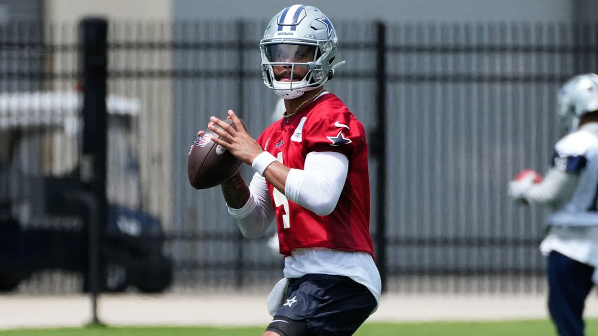 Dallas Cowboys quarterback Dak Prescott (4) goes through a drill during practice at the Ford Center at the Star Training Facility in Frisco, Texas.